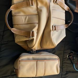 Vintage tan Coach overnight bag and toiletry bag.